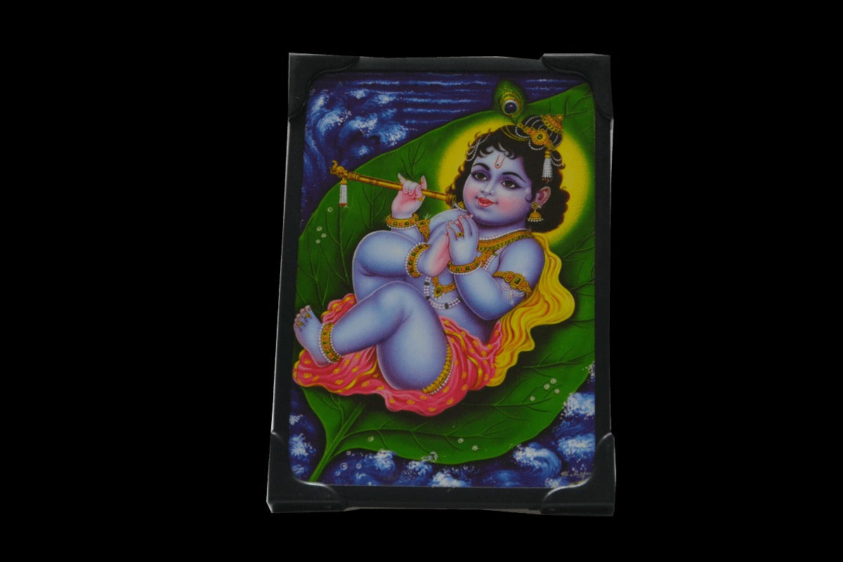 Krishna On Leaf Photo